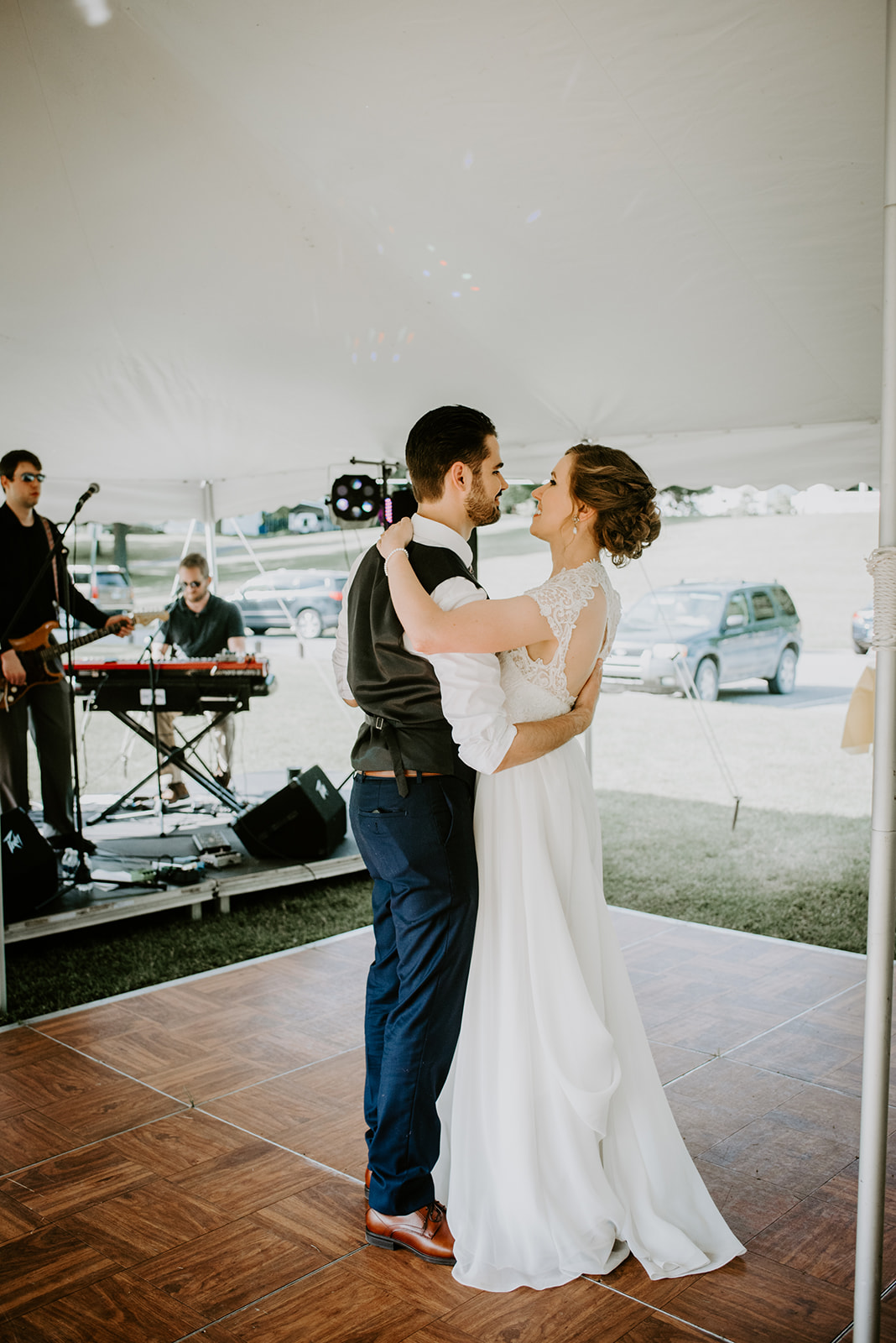 Liz and Dan share their first dance under a tent in Sparta Michigan to a live band