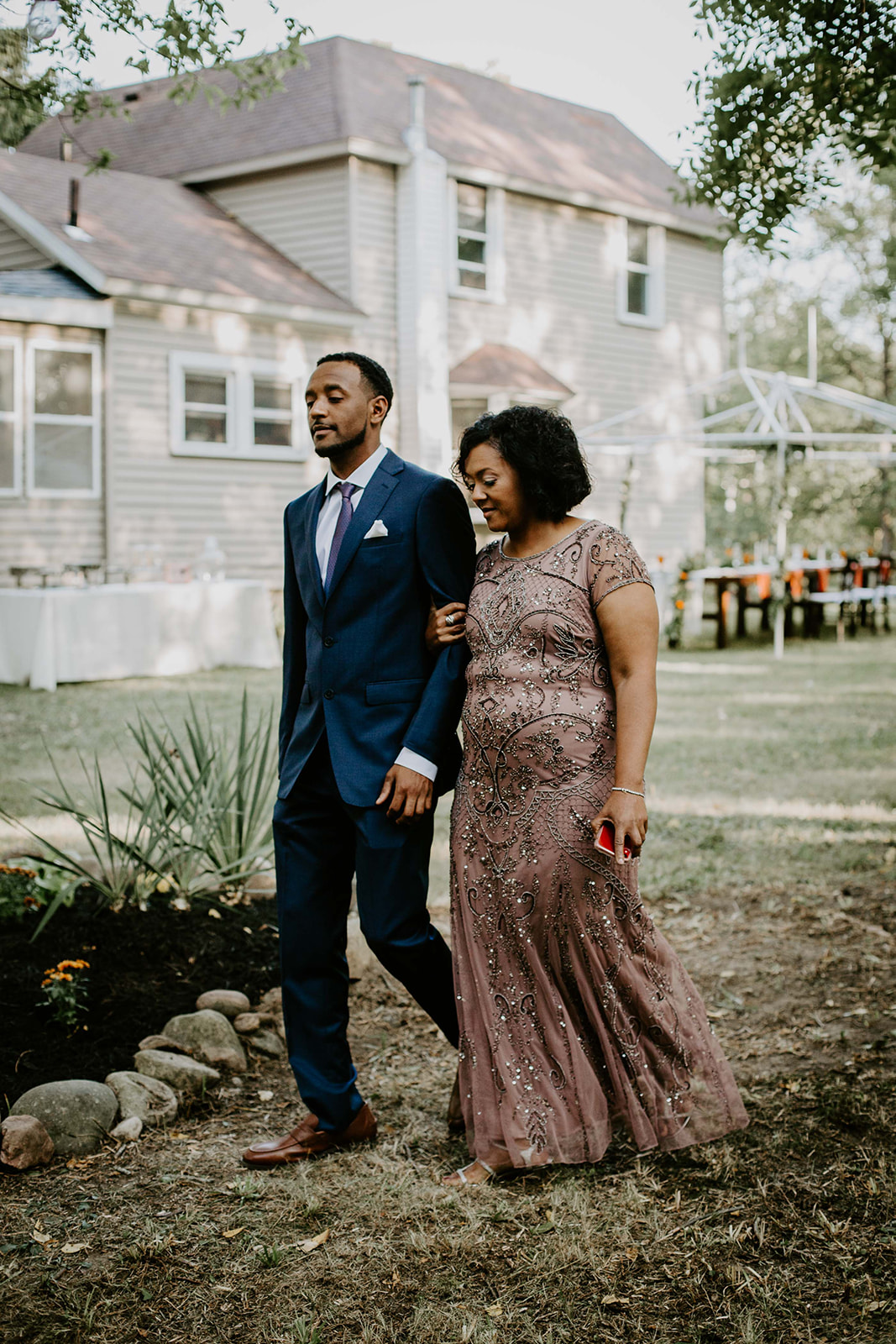 Mother of the Groom walking down aisle. Outdoor wedding. intimate wedding photography. michigan photographer. 