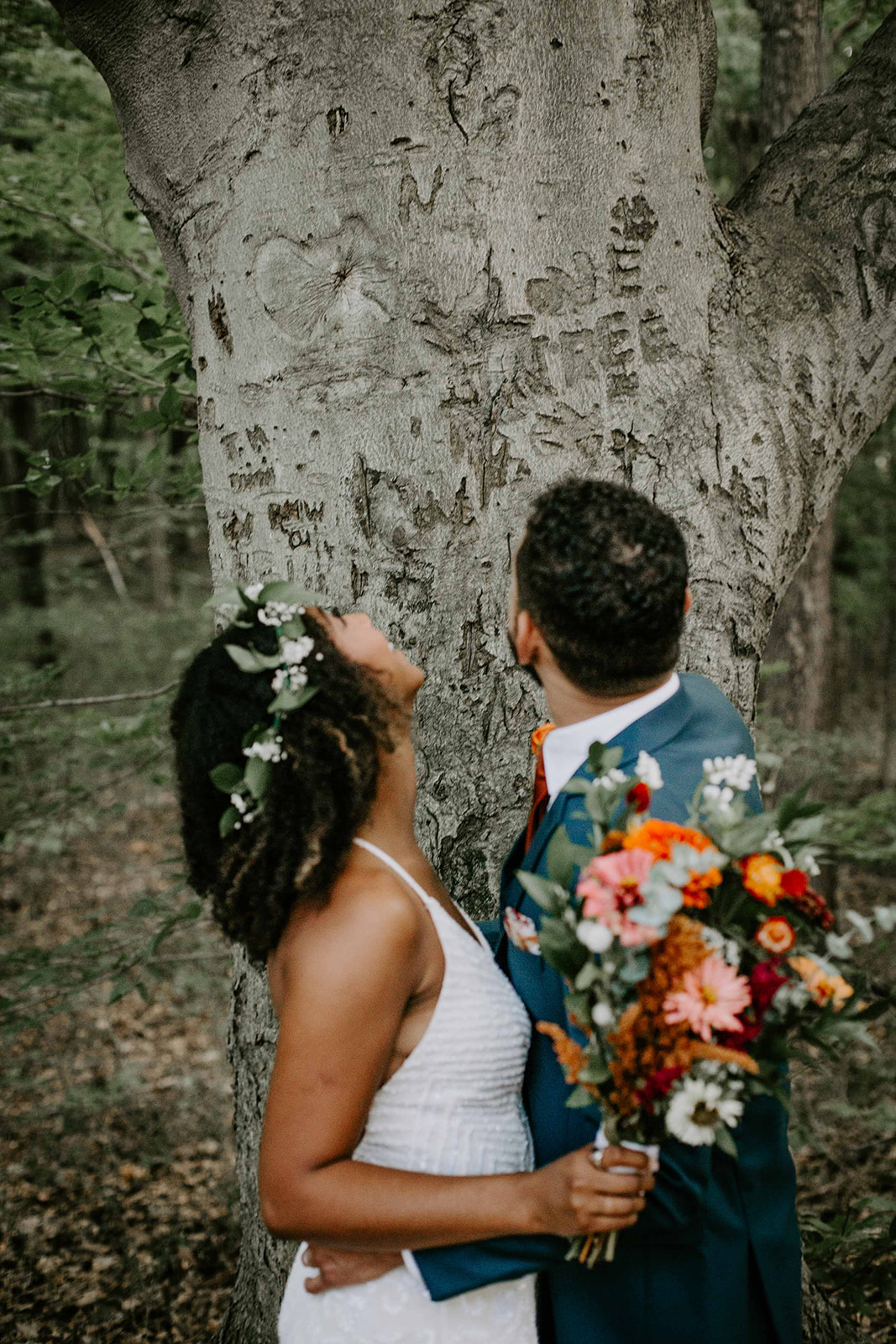 Bride and groom in front of tree. Outdoor wedding. intimate wedding photography. Michigan photographer. 