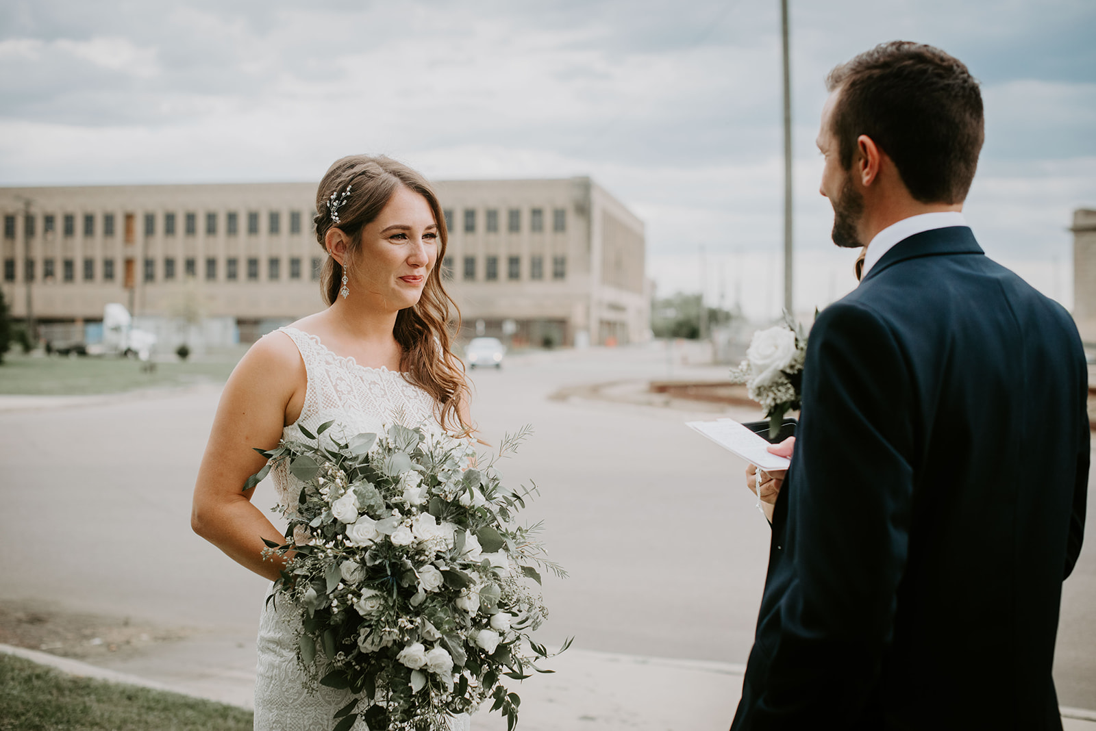 Groom reading vows. Bride and groom in city. Detroit wedding. Detroit, MI. Michigan wedding photographer. Elopement photographer. 