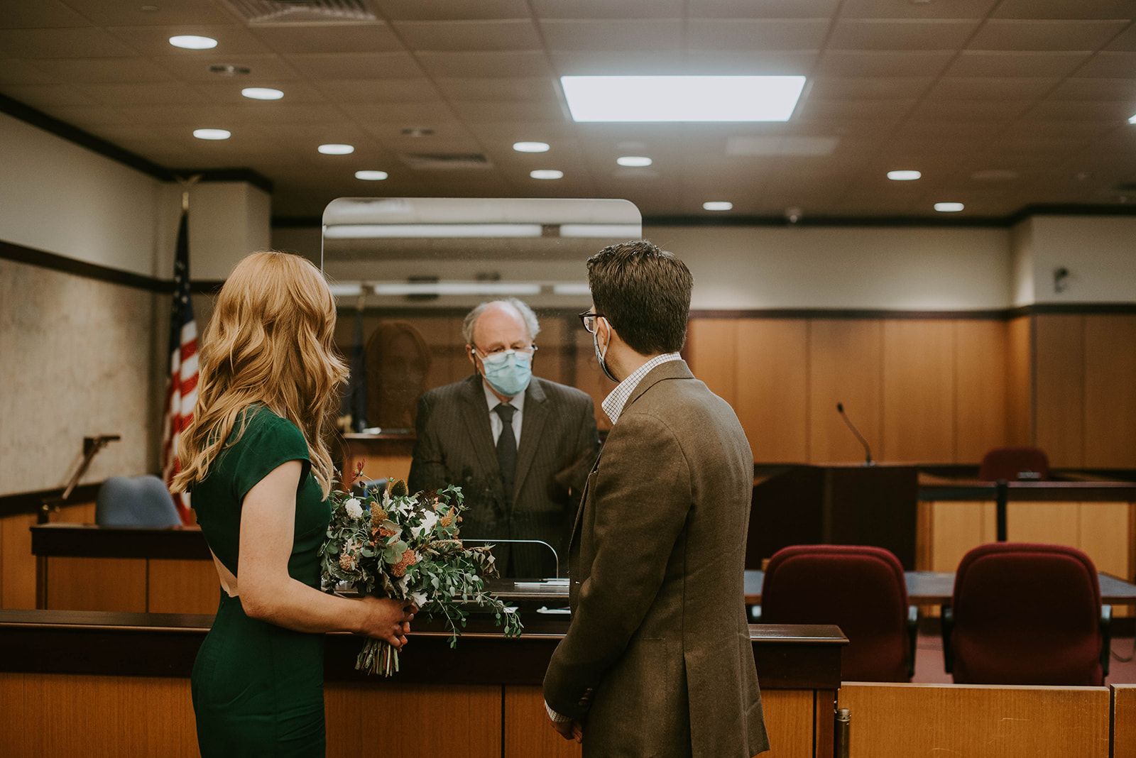 Bride and Groom in courthouse. Kalamazoo, mi. Elopement Photographer. Kalamazoo courthouse elopement. 