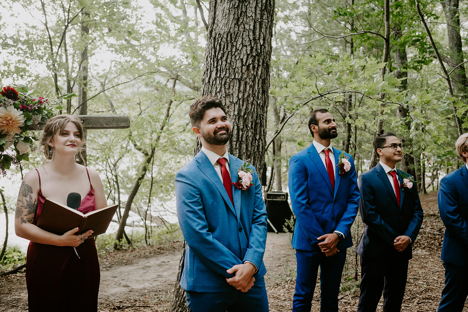 summer camp wedding with reds and blues wedding florals and multicultural wedding photography