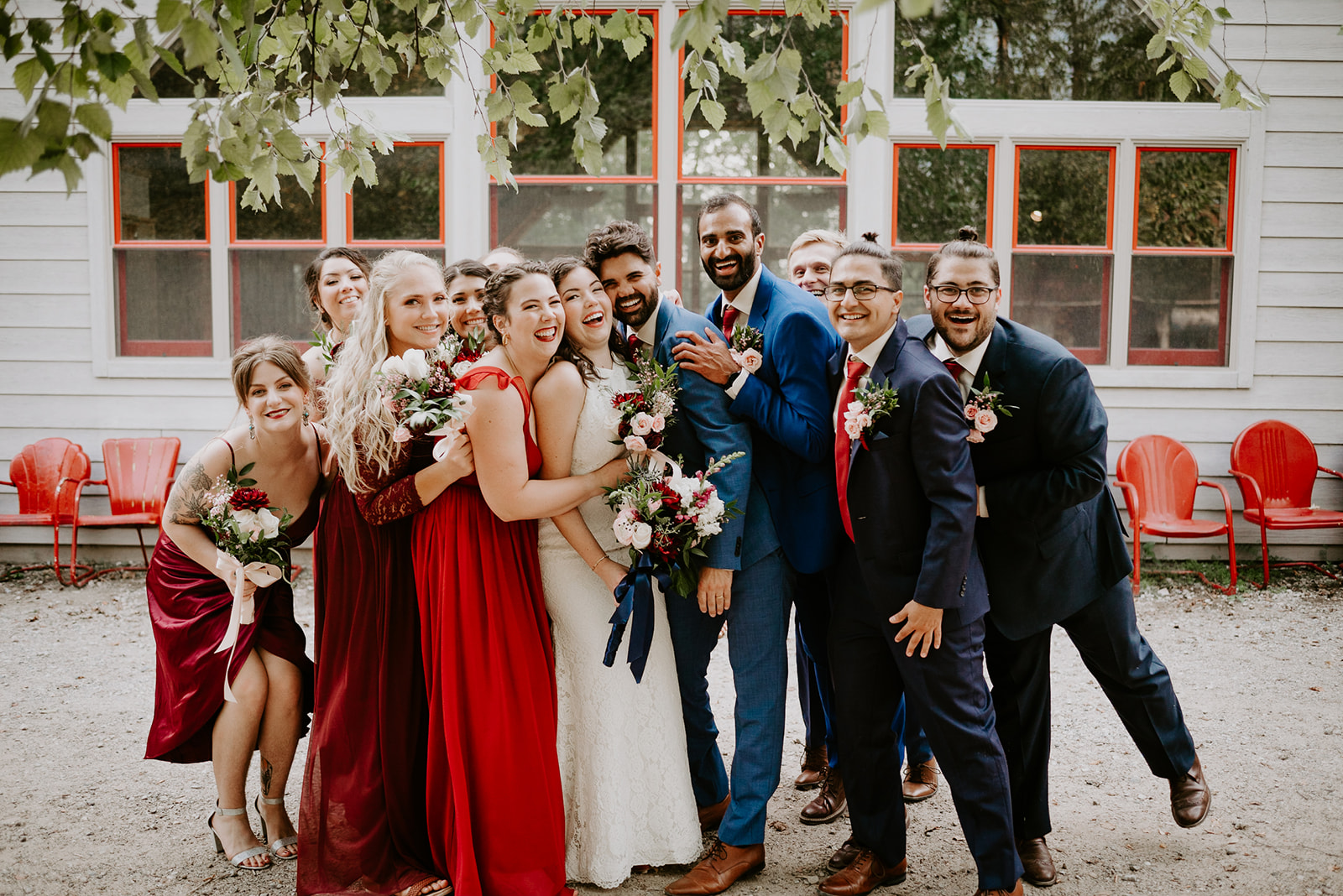 summer camp wedding with reds and blues wedding florals and multicultural wedding photography