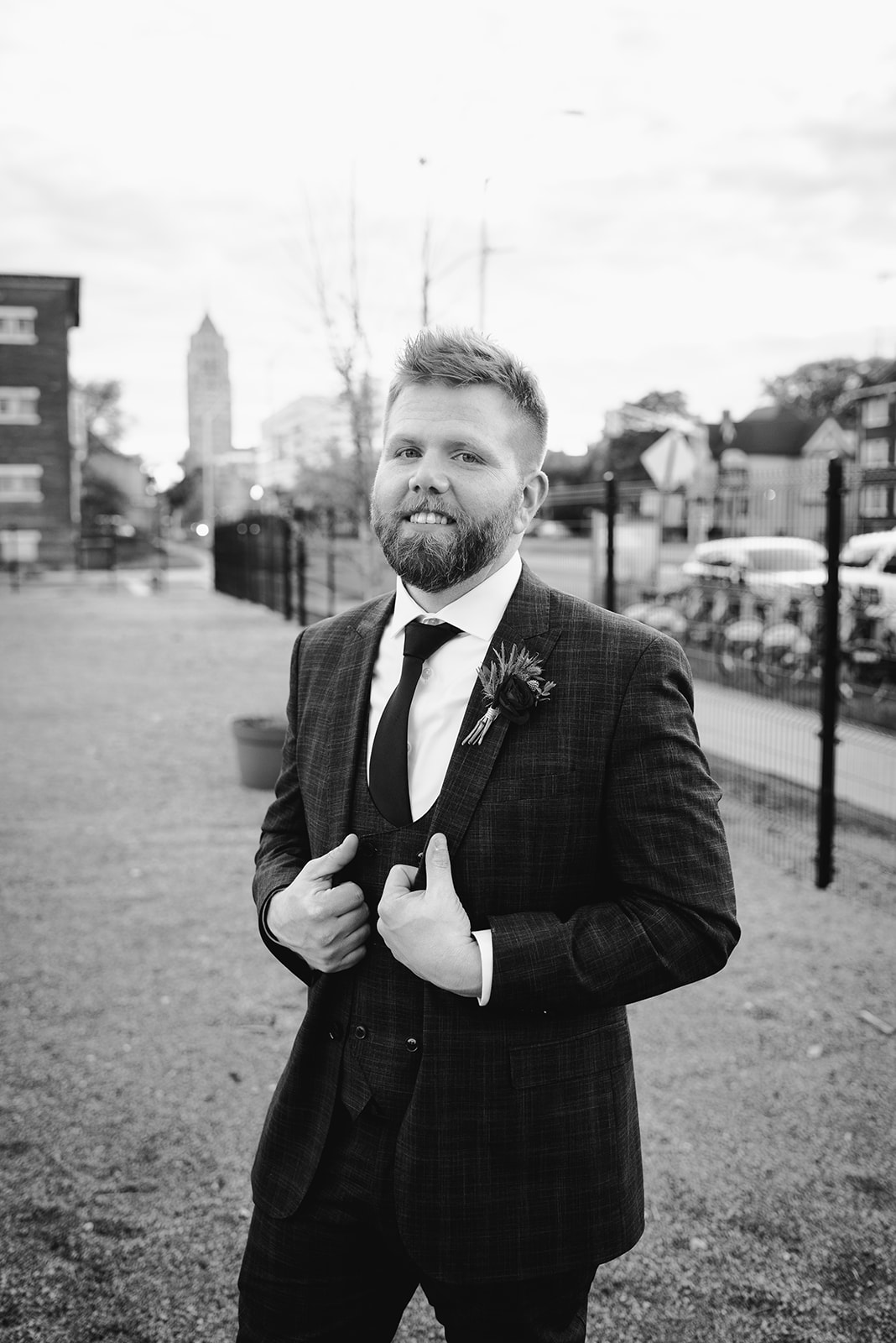 solo groom portrait outside of chroma detroit in michigan an elegant black tie wedding captured by Liv Lyszyk Photography a queer wedding photographer based out of Grand Rapids Michigan