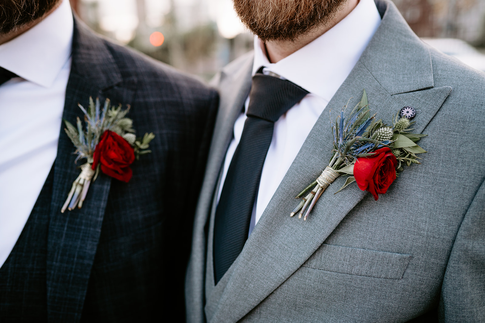 close up shot of florals for two grooms outside of chroma detroit in michigan an elegant black tie wedding captured by Liv Lyszyk Photography a queer wedding photographer based out of Grand Rapids Michigan
