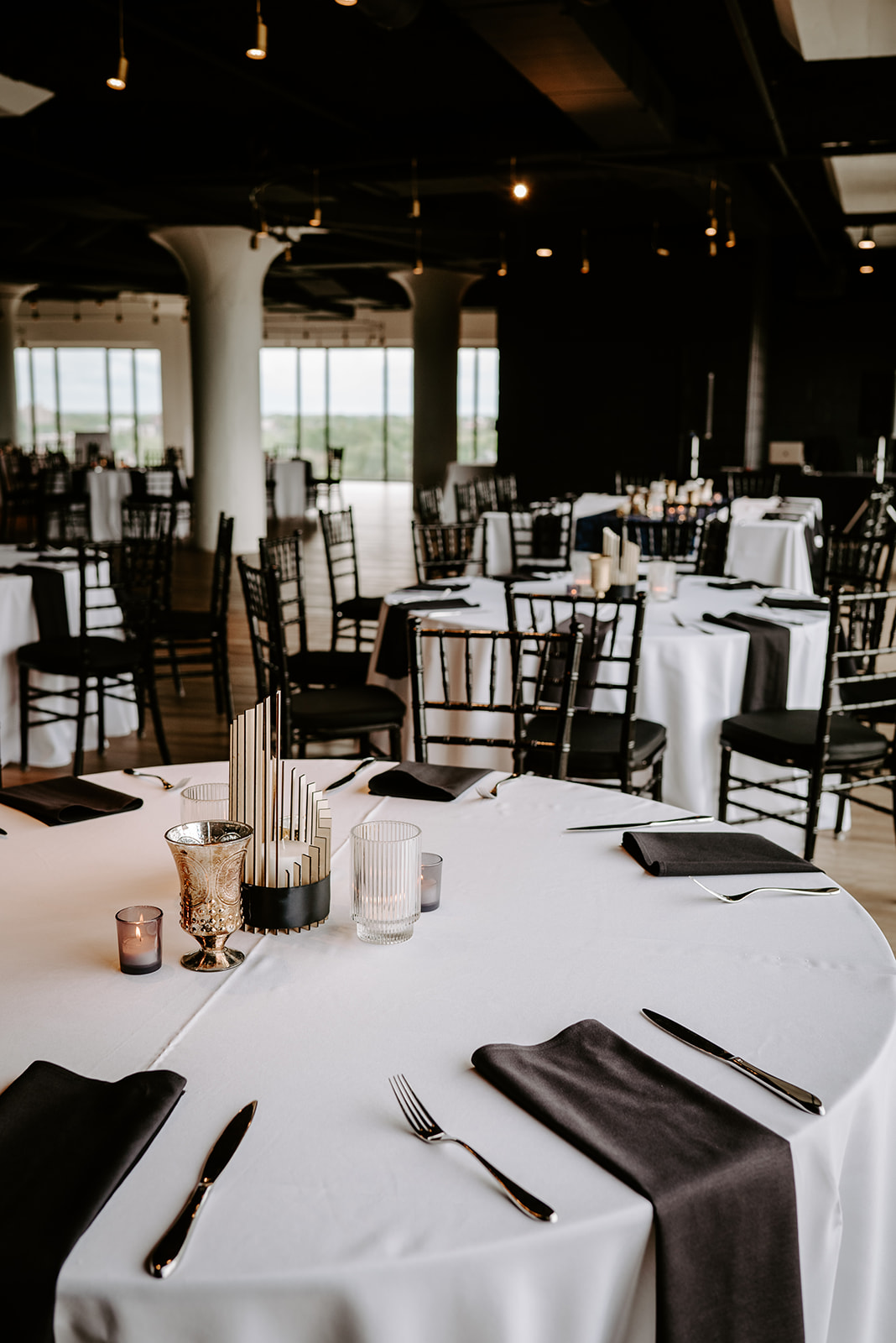 black and white table decor at chroma detroit in michigan an elegant black tie wedding captured by Liv Lyszyk Photography a queer wedding photographer based out of Grand Rapids Michigan