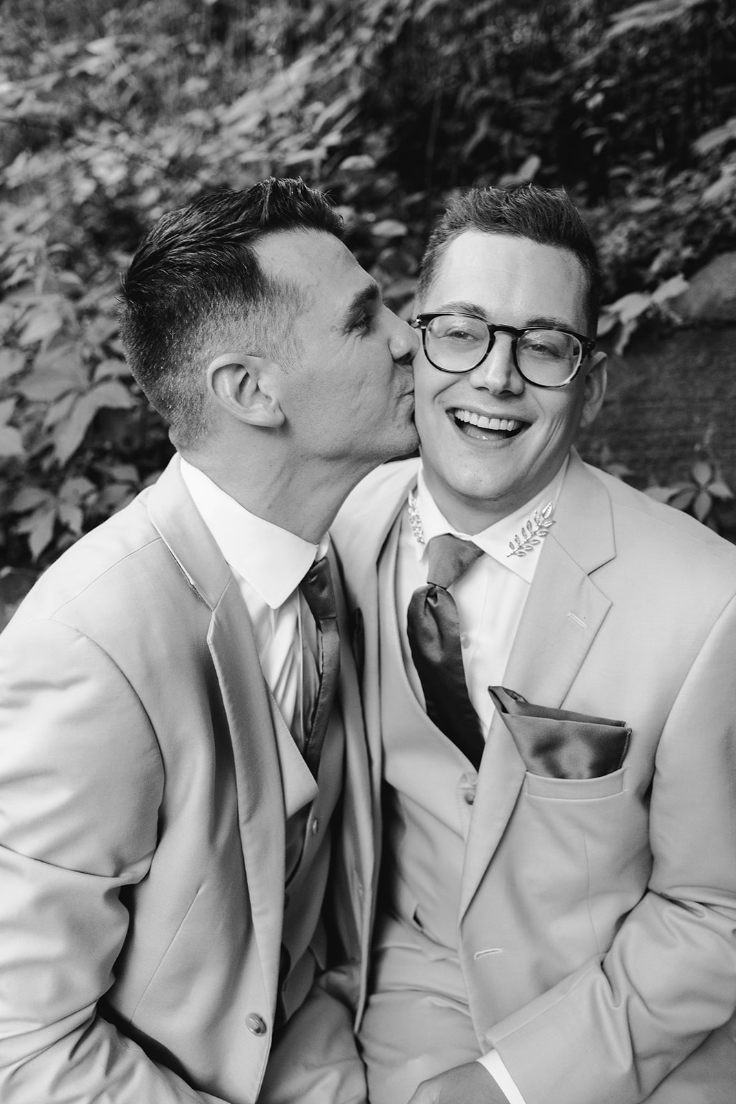 lgbt boho neutral wedding at john ball zoo in grand rapids michigan black and white image of two grooms 