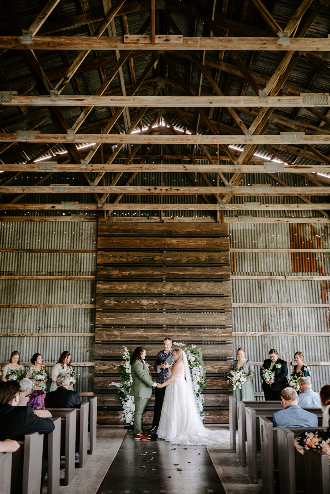 michigan spring DIY lesbian wedding at black sheep shelter ceremony photo