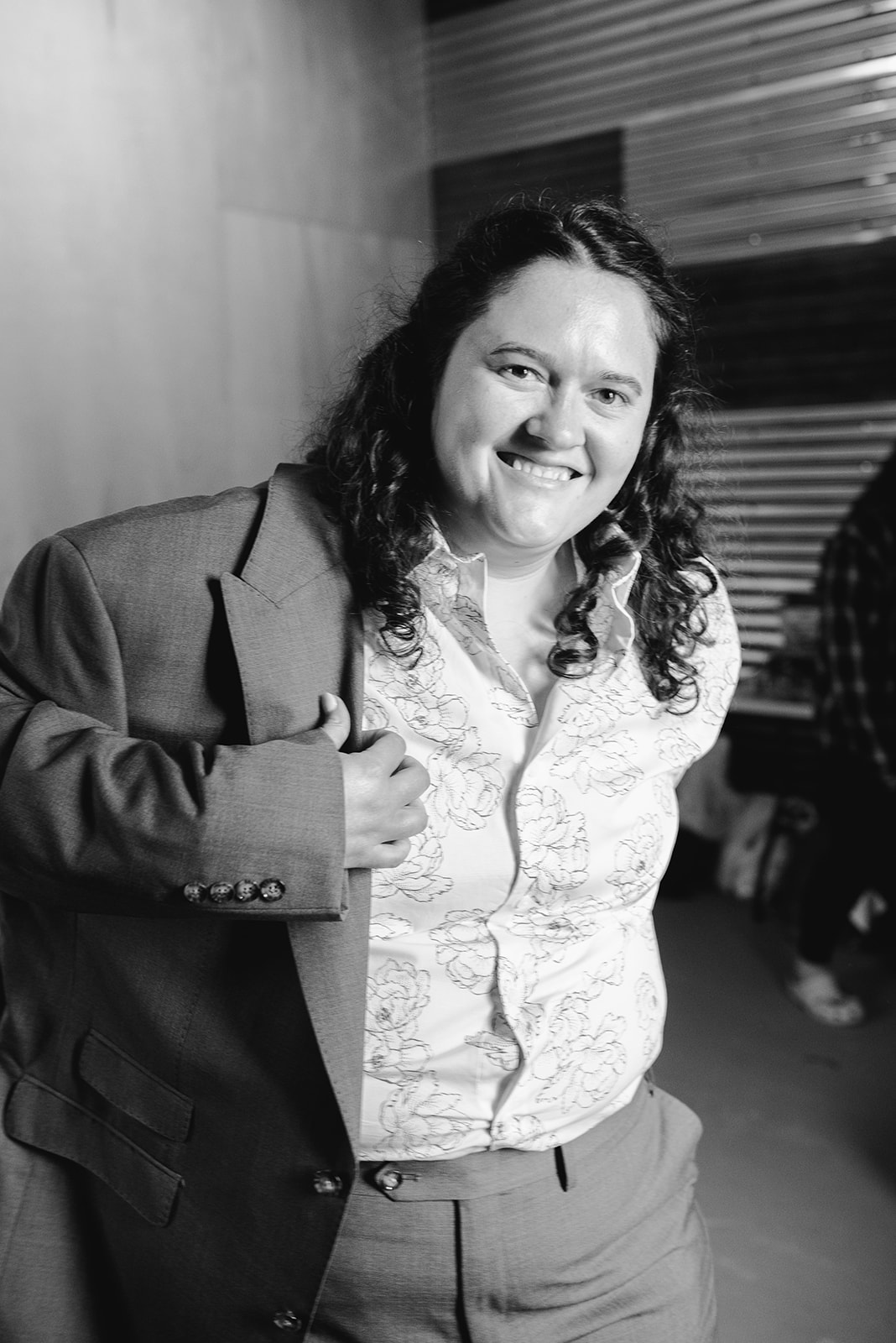 michigan spring DIY lesbian wedding at black sheep shelter bride wearing suit 