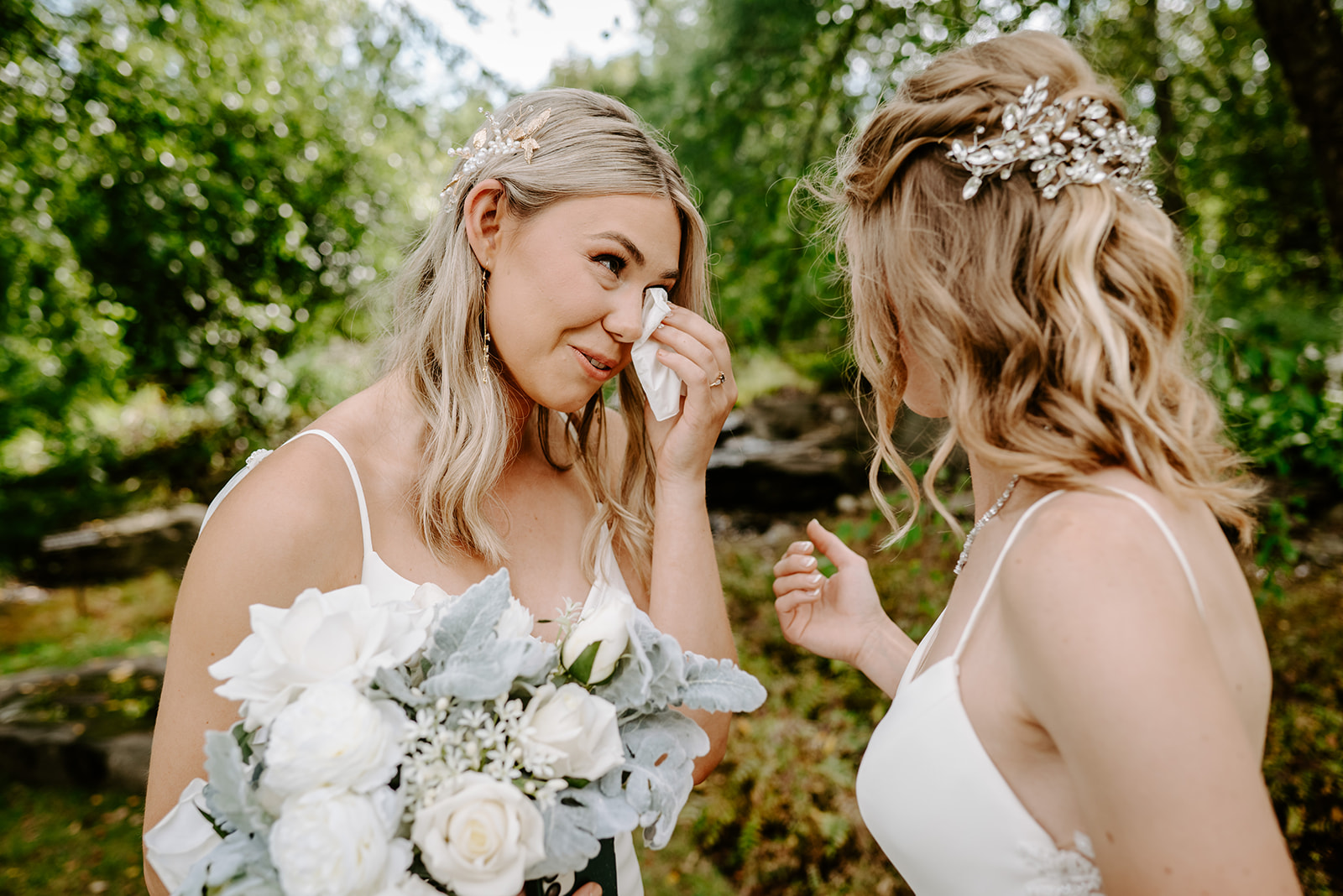 two brides getting married at Meijer gardens at a Grand Rapids LGBT Garden wedding during their emotional first look