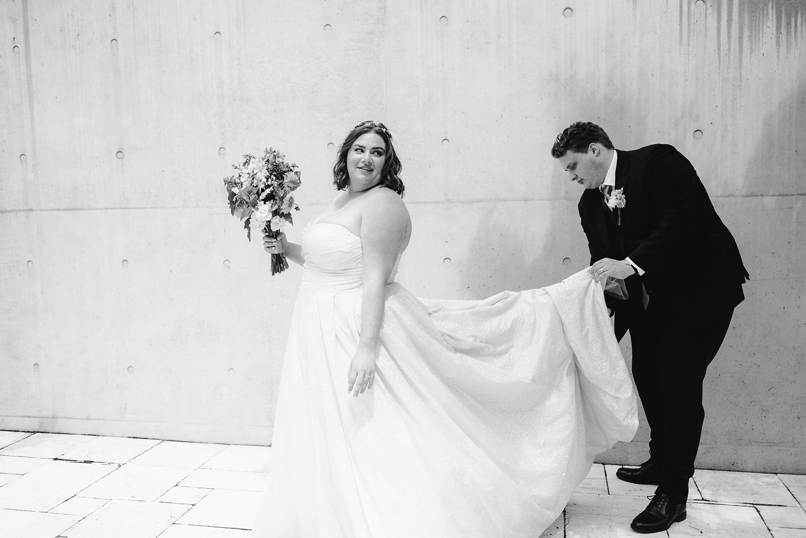 black and white photo of a bride and groom outside in downtown grand rapids michigan on their wedding day