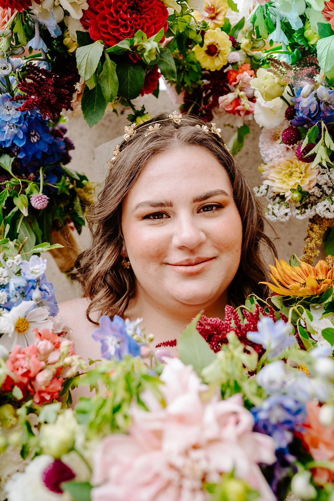 colorful flowers surrounding bride on her wedding day in downtown grand rapids michigan