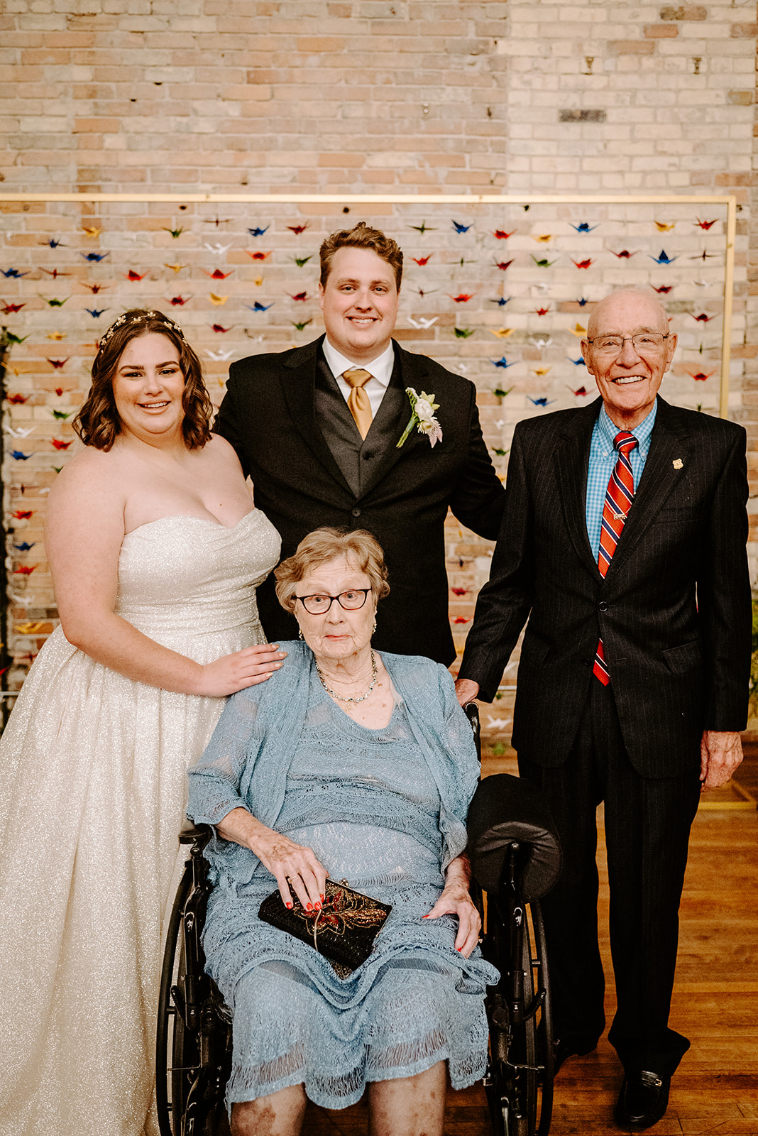 bride and groom with their family at a colorful downtown grand rapids michigan wedding 