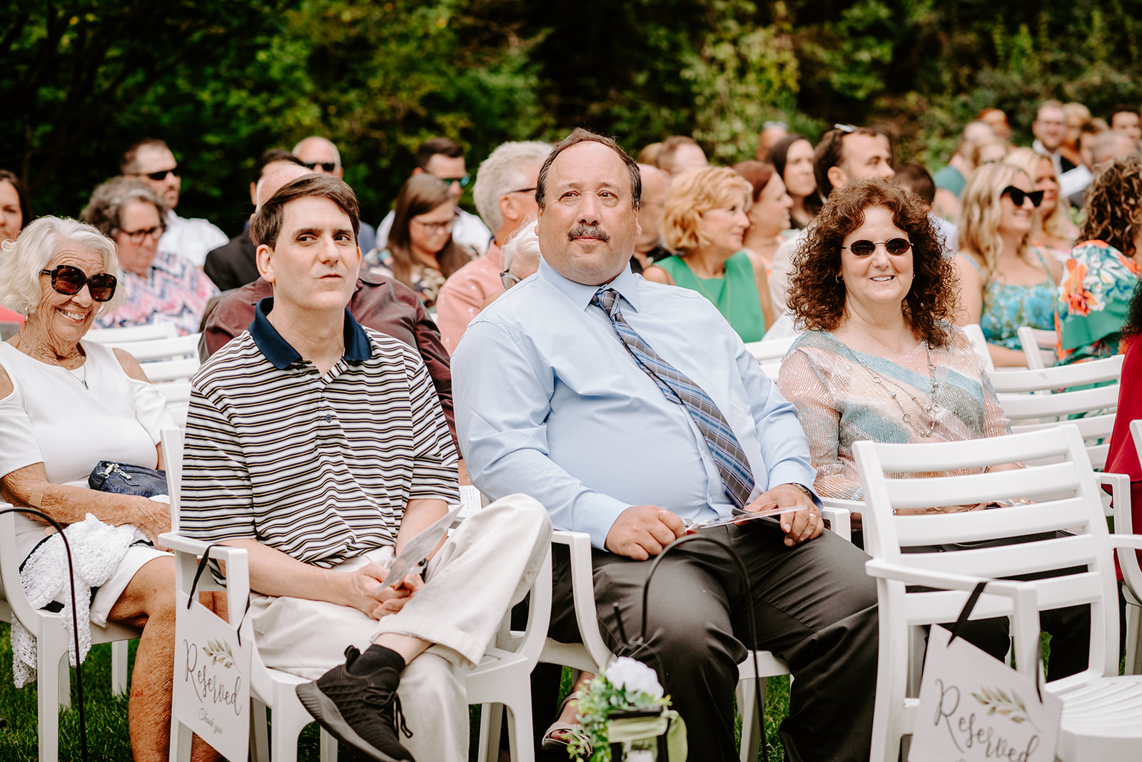 two brides getting married at Meijer gardens at a Grand Rapids LGBT Garden wedding guests waiting for outdoor ceremony to start