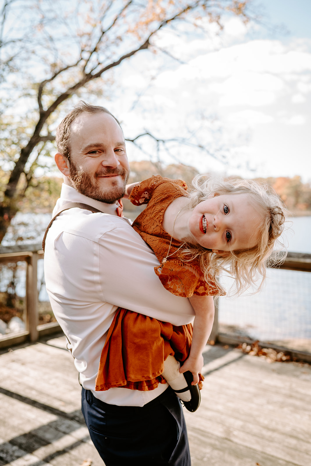 groom and niece at fall wedding at camp merrie woode by grand rapids wedding photographer Liv Lyszyk Photography