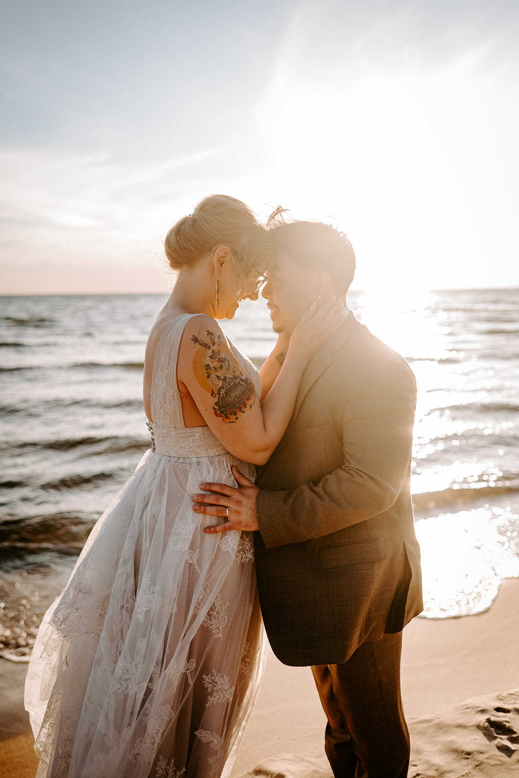 golden hour portrait of bride and groom at pj hoffmaster state park chinese american elopement photographed by Grand Rapids multicultural wedding photographer Liv Lyszyk Photographer