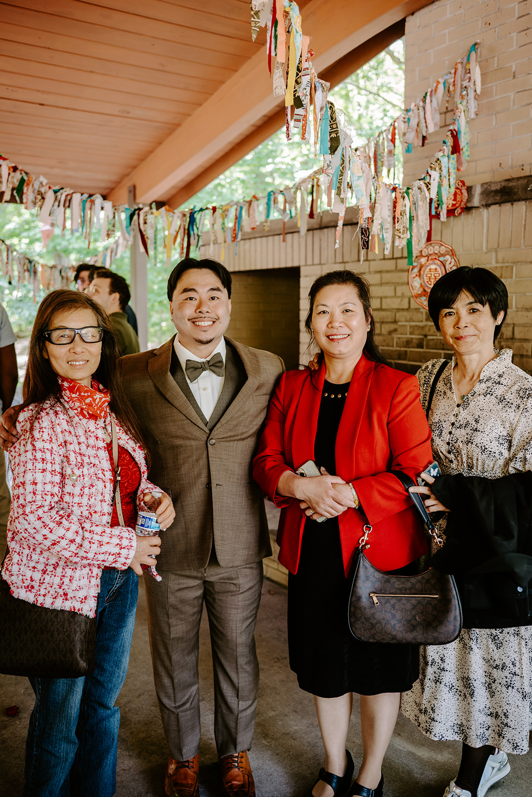 Groom and family at pj hoffmaster state park chinese american elopement photographed by Grand Rapids multicultural wedding photographer Liv Lyszyk Photographer
